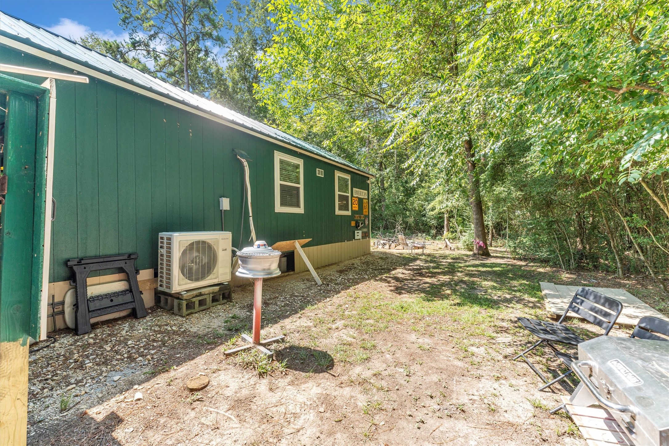 2075 Mangum Road Livingston, TX 77351 - Photo 42 of 45 a backyard of a house with table and chairs