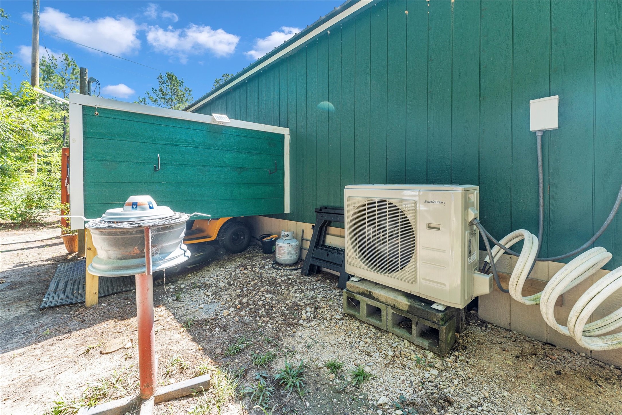 2075 Mangum Road Livingston, TX 77351 - Photo 43 of 45 a backyard of a house with table and chairs