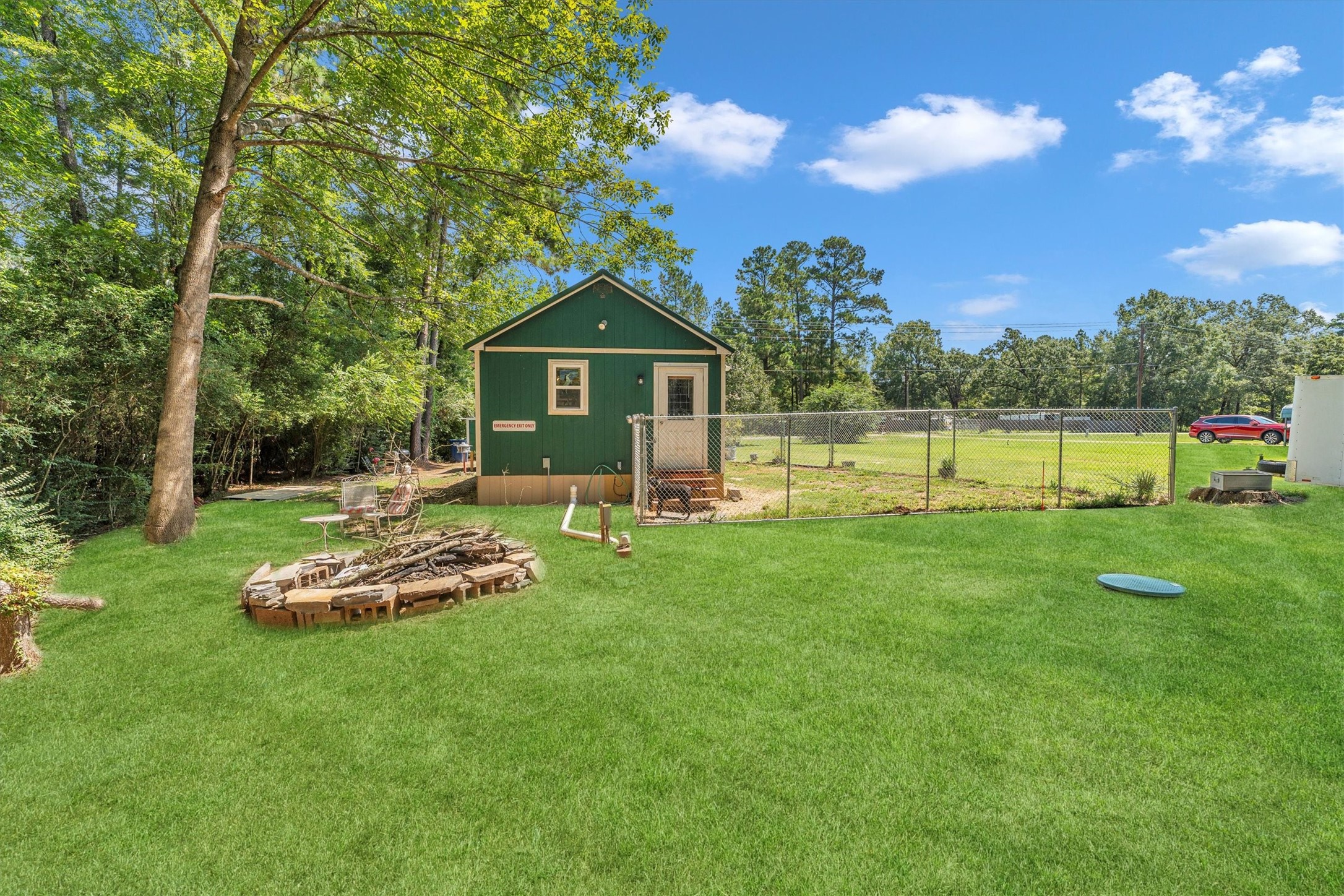 2075 Mangum Road Livingston, TX 77351 - Photo 9 of 45 a front view of a house with a yard table and chairs