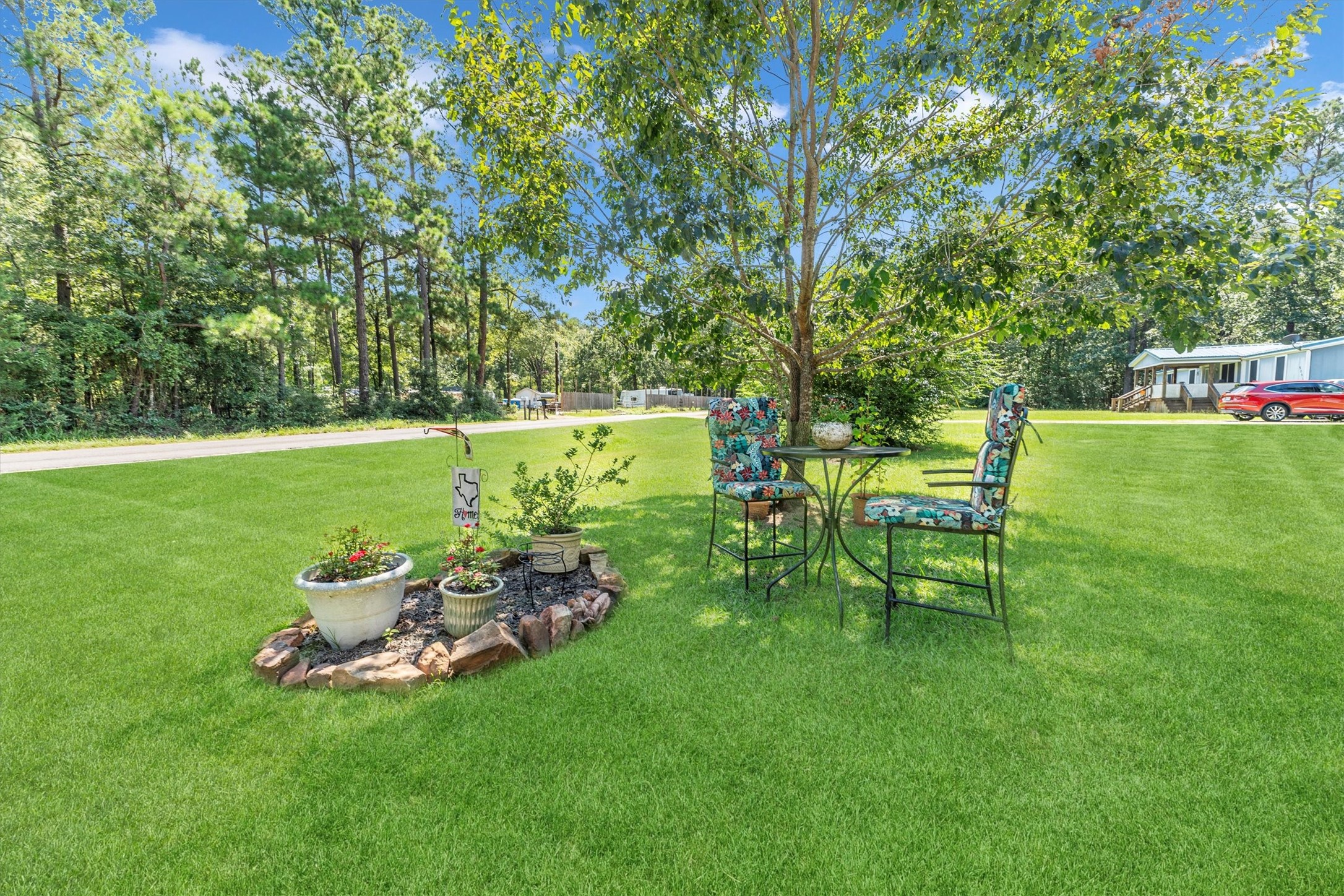 2075 Mangum Road Livingston, TX 77351 - Photo 10 of 45 a backyard of a house with table and chairs