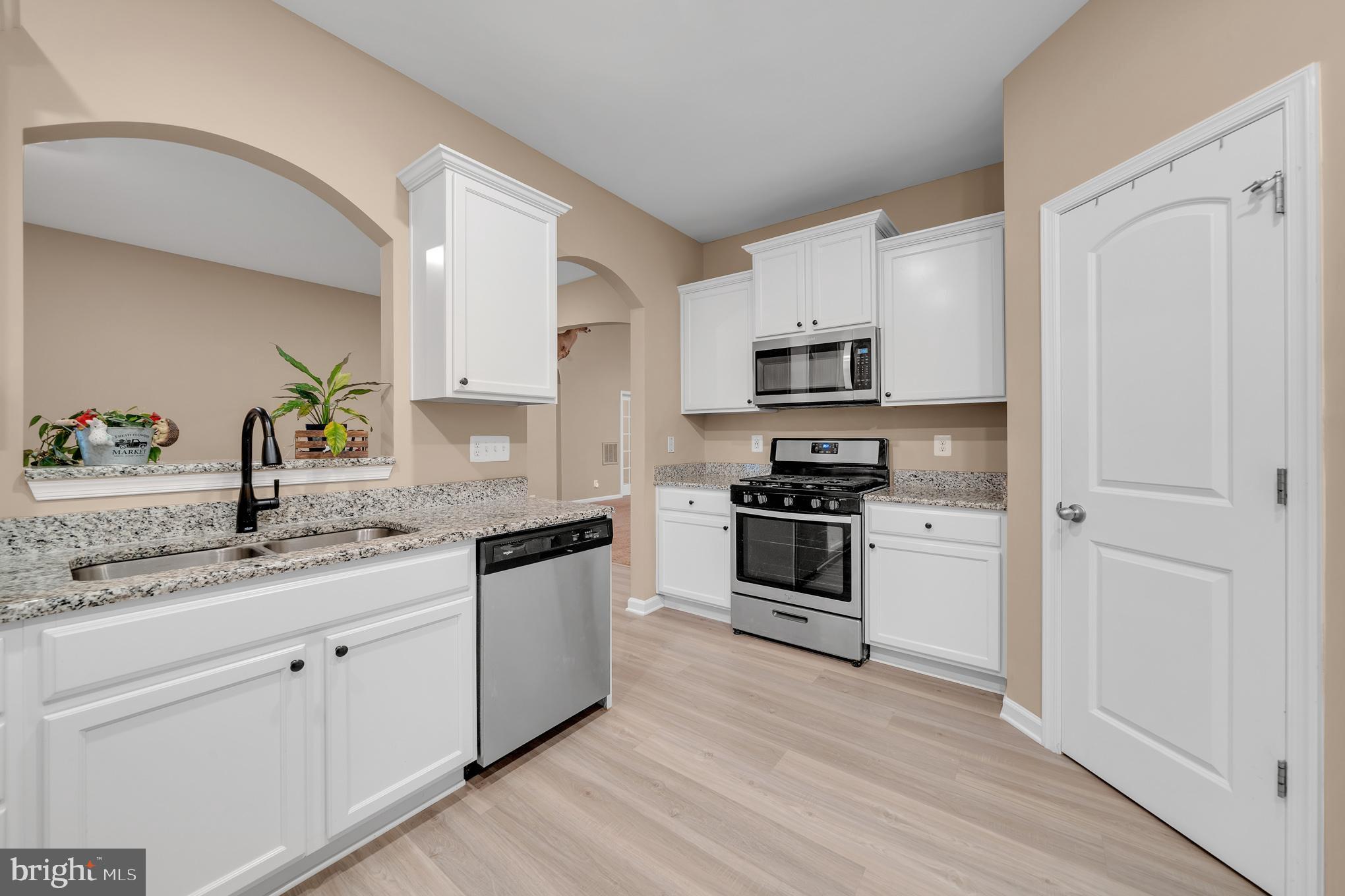 17 Ledger Drive Hanover, PA 17331 - Photo 6 of 23 a kitchen with granite countertop white cabinets and white appliances
