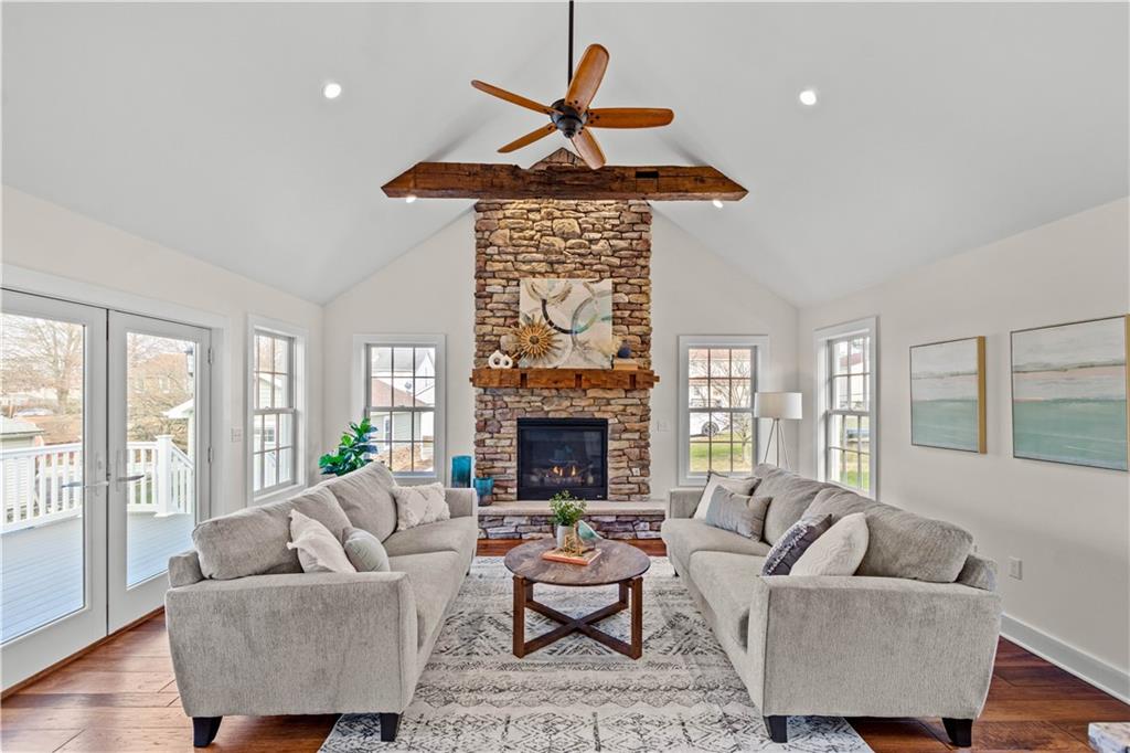 411 Georgetown Road Lawrence, PA 15055 - Photo 16 of 40 a living room with furniture a fireplace and a large window