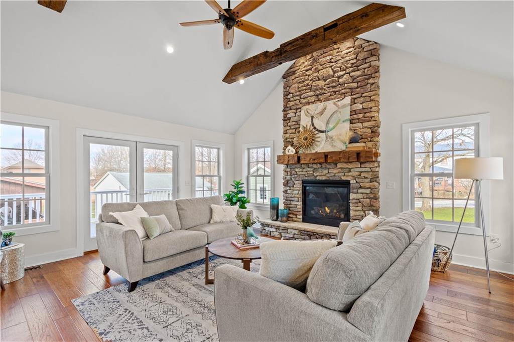 411 Georgetown Road Lawrence, PA 15055 - Photo 17 of 40 a living room with furniture a fireplace and wooden floor