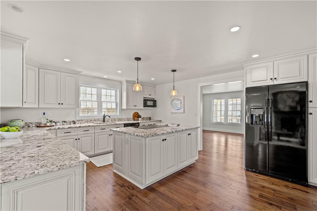 411 Georgetown Road Lawrence, PA 15055 - Photo 19 of 40 a kitchen with stainless steel appliances granite countertop a sink stove and refrigerator