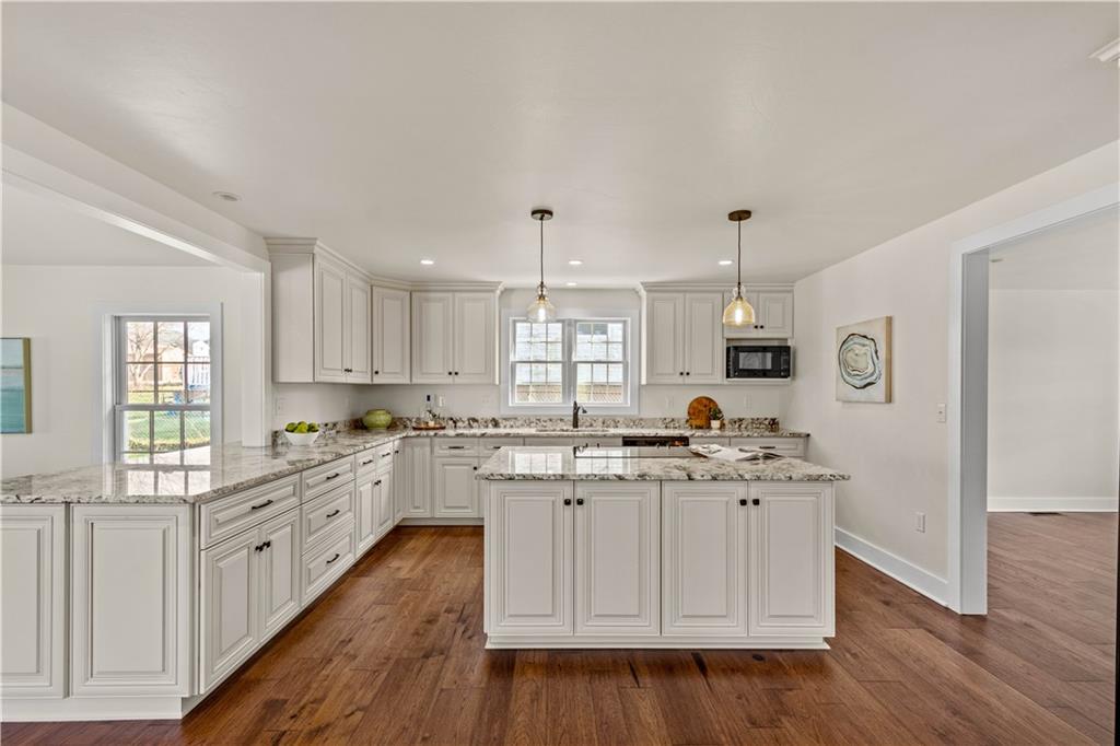 411 Georgetown Road Lawrence, PA 15055 - Photo 20 of 40 a kitchen with white cabinets sink and stove