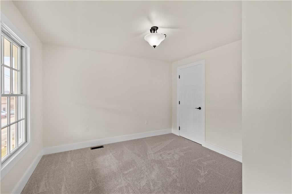 411 Georgetown Road Lawrence, PA 15055 - Photo 24 of 40 a view of an empty room with a window