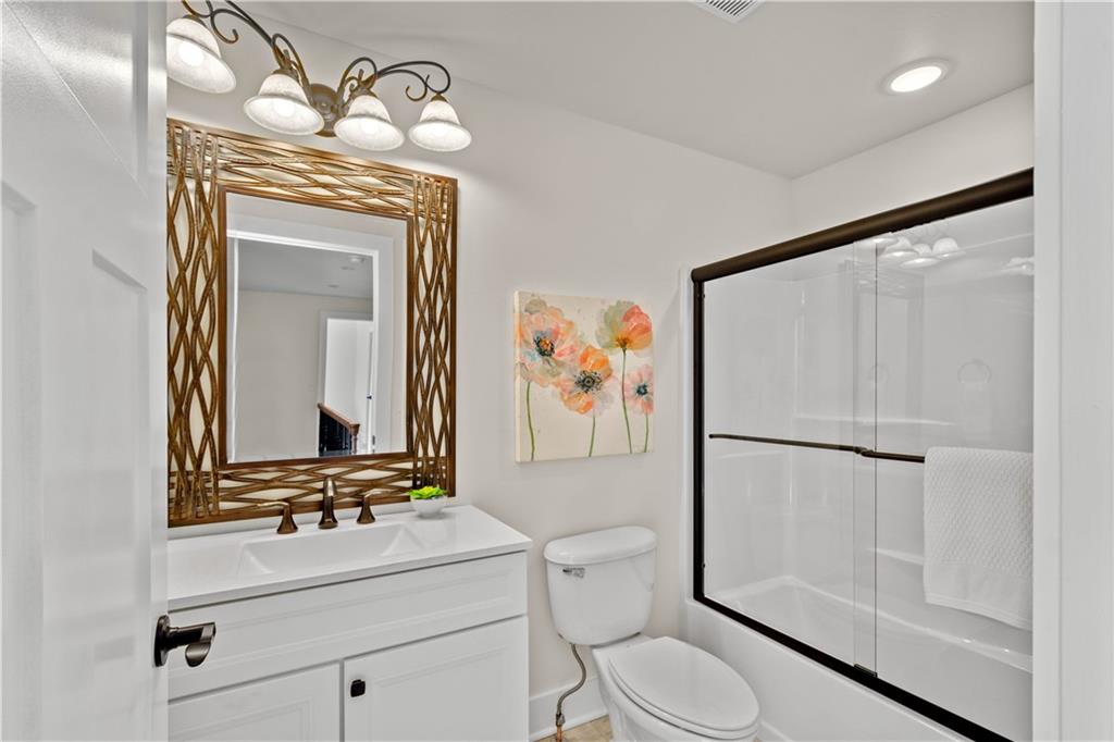 411 Georgetown Road Lawrence, PA 15055 - Photo 29 of 40 a bathroom with a toilet sink vanity and mirror