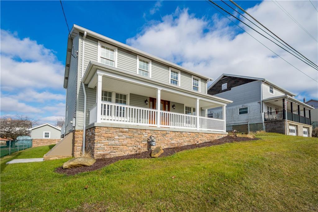 411 Georgetown Road Lawrence, PA 15055 - Photo 3 of 40 a front view of a house with a yard