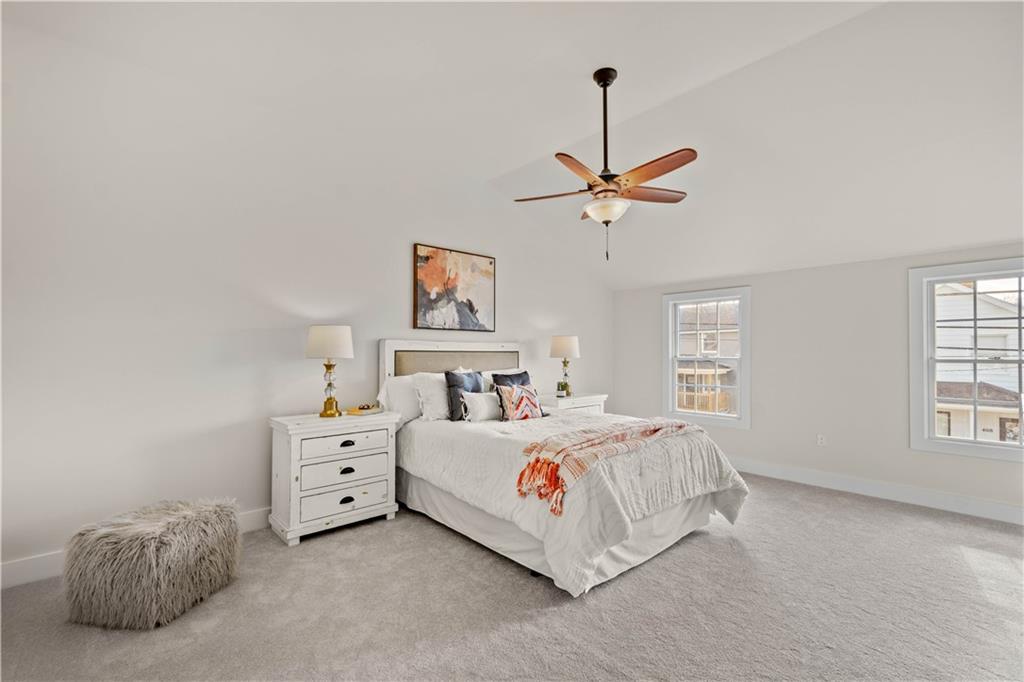 411 Georgetown Road Lawrence, PA 15055 - Photo 33 of 40 a bedroom with a bed a chandelier and a window