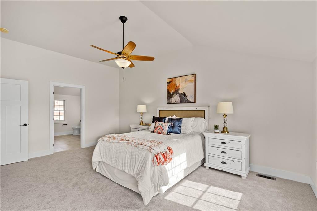 411 Georgetown Road Lawrence, PA 15055 - Photo 34 of 40 a bedroom with a bed a chandelier and a window