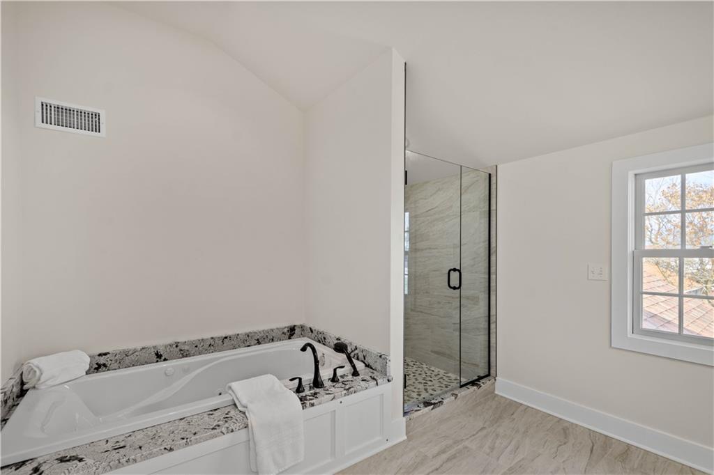 411 Georgetown Road Lawrence, PA 15055 - Photo 37 of 40 a bathroom with a bathtub and shower