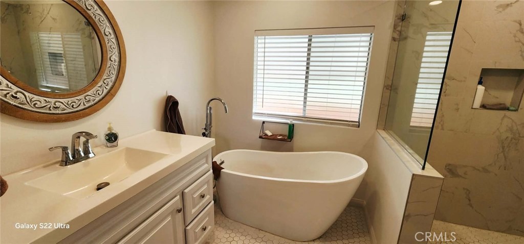 8651 Foothill Boulevard, Unit 159 Rancho Cucamonga, CA 91730 - Photo 12 of 18 a bathroom with a sink and a mirror