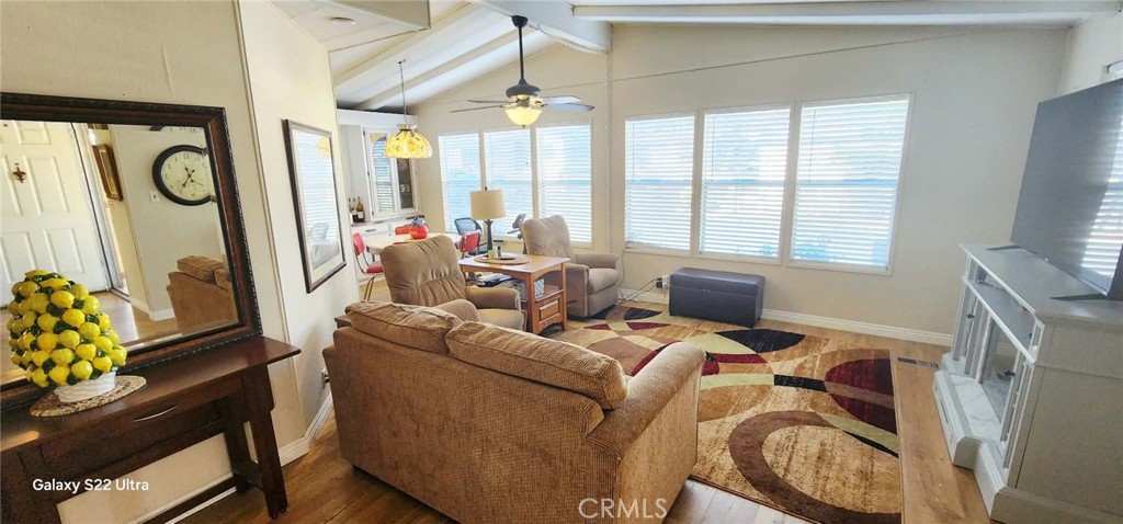 8651 Foothill Boulevard, Unit 159 Rancho Cucamonga, CA 91730 - Photo 9 of 18 a living room with furniture and a flat screen tv