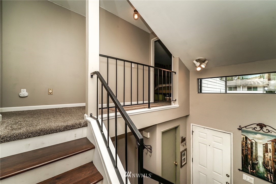 4109 Northeast 5th Street Renton, WA 98059 - Photo 17 of 26 a view of entryway and hall with wooden floor
