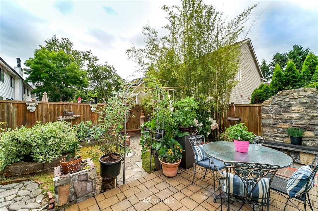 4109 Northeast 5th Street Renton, WA 98059 - Photo 5 of 26 a view of a chairs and table in a backyard