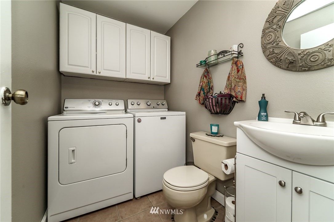 4109 Northeast 5th Street Renton, WA 98059 - Photo 8 of 26 a view of bathroom with a washer and dryer