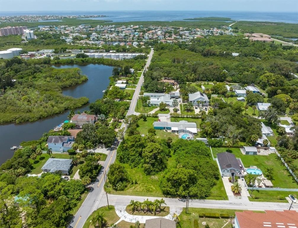 6307 Oelsner Street, Unit 11&12 New Port Richey, FL 34652 - Photo 3 of 11 an aerial view of residential houses with outdoor space and river