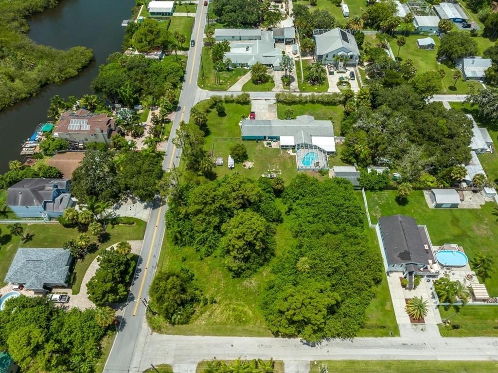 6307 Oelsner Street, Unit 11&12 New Port Richey, FL 34652 - Photo 4 of 11 an aerial view of residential houses with yard