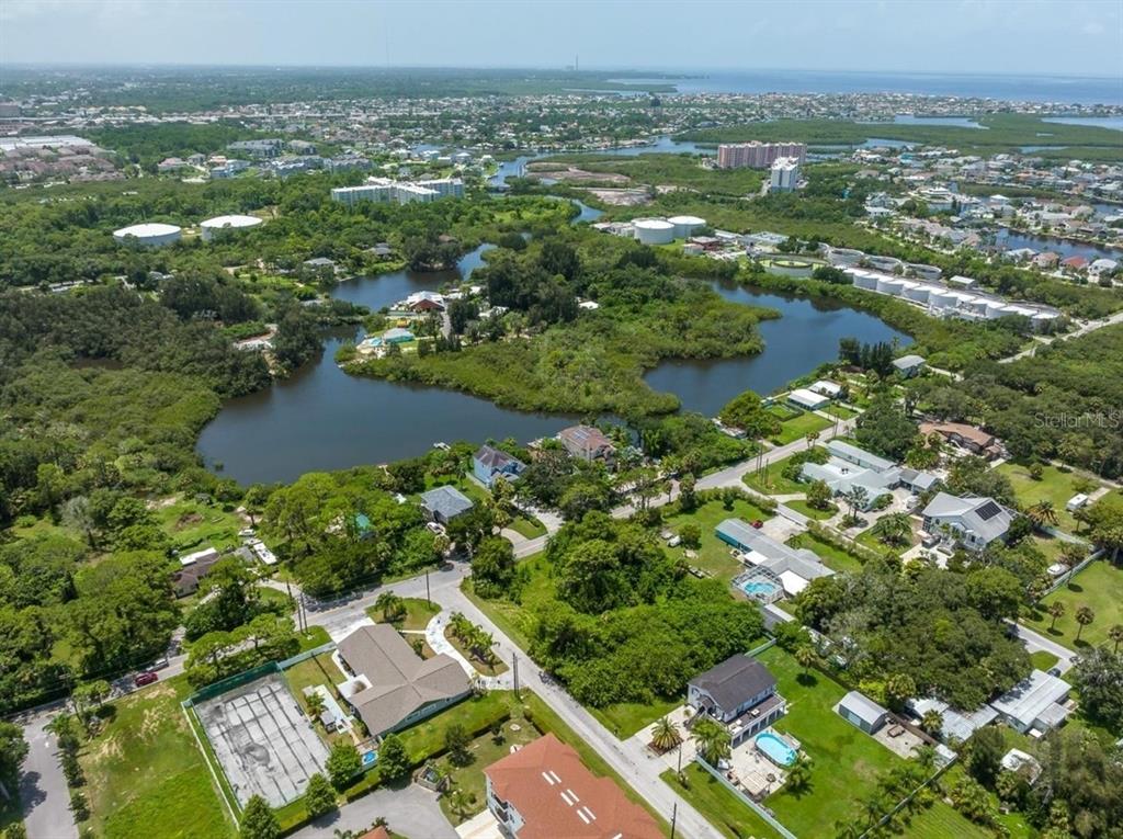 6307 Oelsner Street, Unit 11&12 New Port Richey, FL 34652 - Photo 8 of 11 an aerial view of residential houses with outdoor space and river