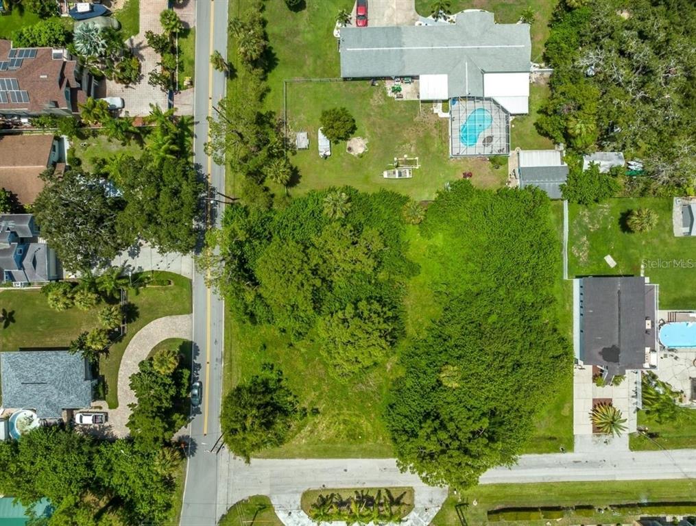 6307 Oelsner Street, Unit 11&12 New Port Richey, FL 34652 - Photo 10 of 11 an aerial view of residential house with an outdoor space and street view
