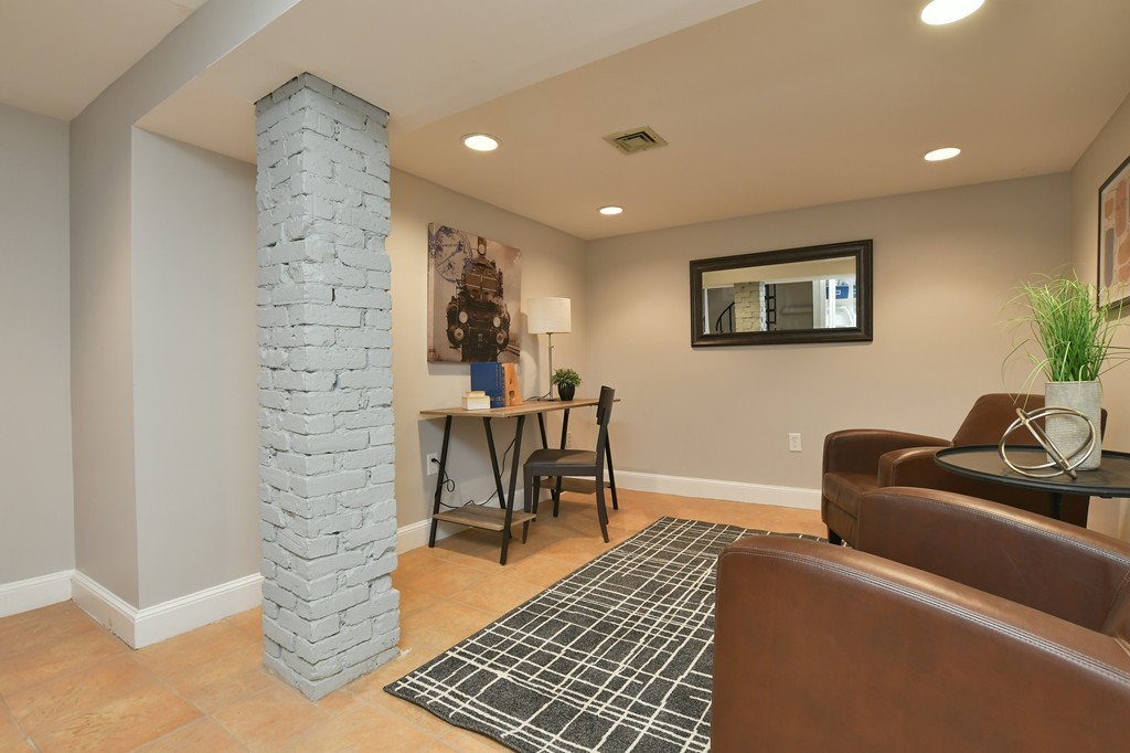 11 Atwood Square, Unit 1 Boston, MA 02130 - Photo 12 of 23 a living room with furniture and a rug
