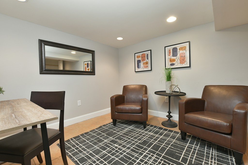 11 Atwood Square, Unit 1 Boston, MA 02130 - Photo 13 of 23 a living room with furniture and a rug