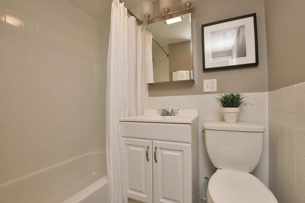 11 Atwood Square, Unit 1 Boston, MA 02130 - Photo 15 of 23 a bathroom with a toilet a sink and mirror