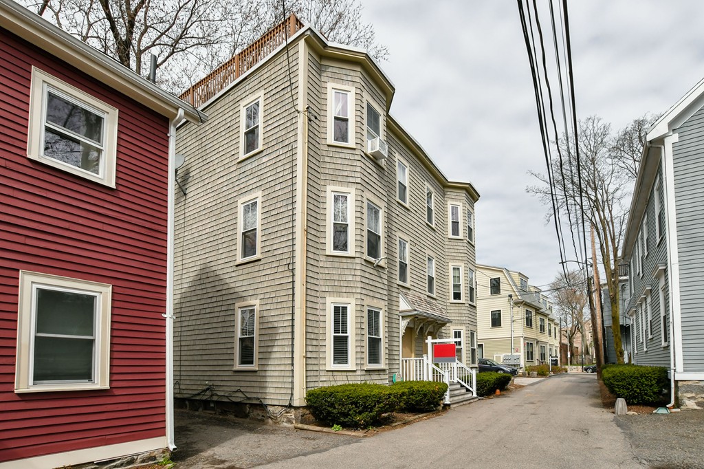11 Atwood Square, Unit 1 Boston, MA 02130 - Photo 16 of 23 a front view of a house with a yard