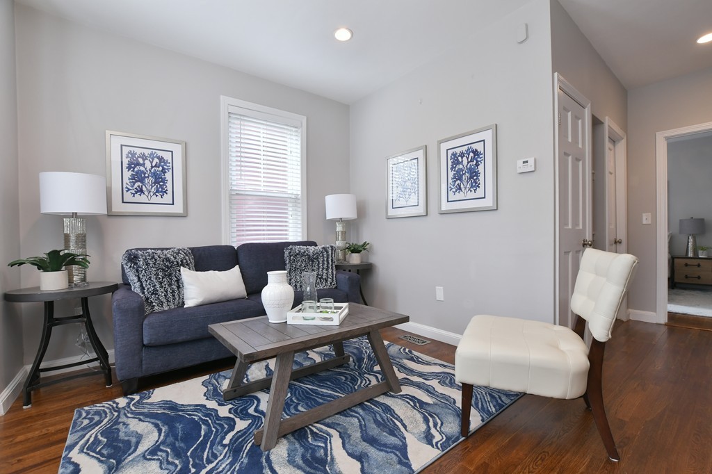 11 Atwood Square, Unit 1 Boston, MA 02130 - Photo 7 of 23 a living room with furniture and wooden floor