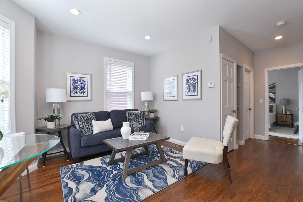 11 Atwood Square, Unit 1 Boston, MA 02130 - Photo 8 of 23 a living room with furniture and wooden floor