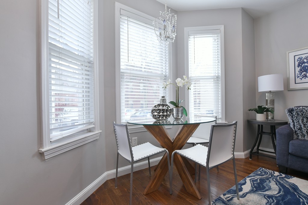 11 Atwood Square, Unit 1 Boston, MA 02130 - Photo 9 of 23 a view of a dining room with furniture window and wooden floor