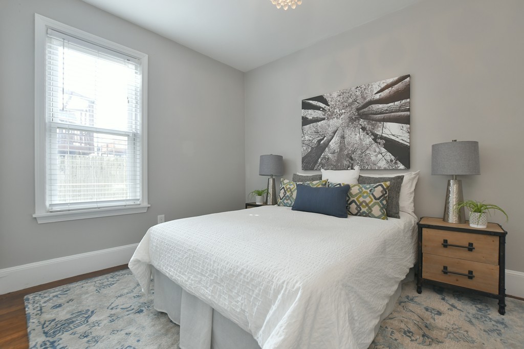 11 Atwood Square, Unit 1 Boston, MA 02130 - Photo 10 of 23 a bedroom with a bed and a window