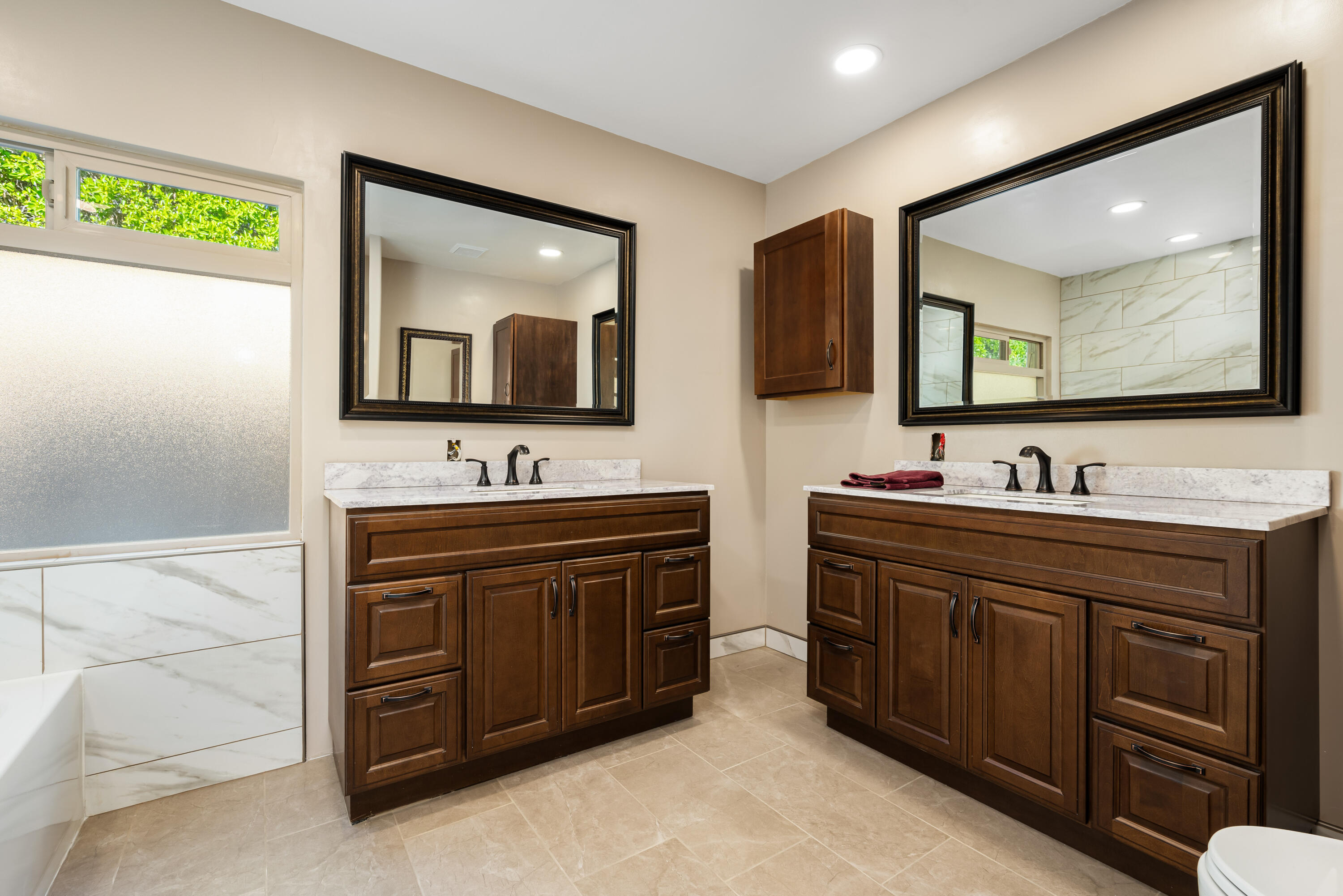 74096 Angels Cp Road Palm Desert, CA 92260 - Photo 15 of 33 a bathroom with a double vanity sink and a mirror