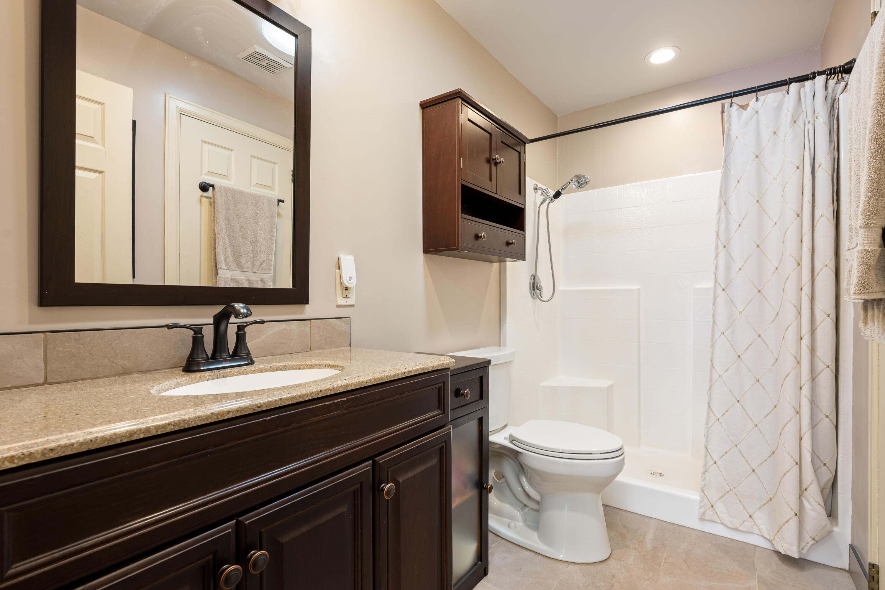 74096 Angels Cp Road Palm Desert, CA 92260 - Photo 17 of 33 a bathroom with a sink a toilet a mirror and shower