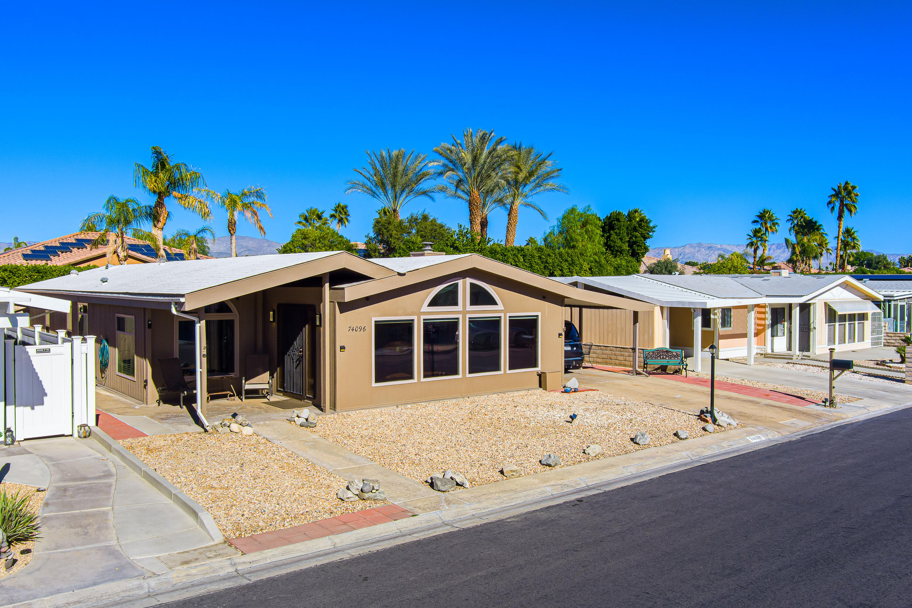 74096 Angels Cp Road Palm Desert, CA 92260 - Photo 19 of 33 a front view of a house with a porch