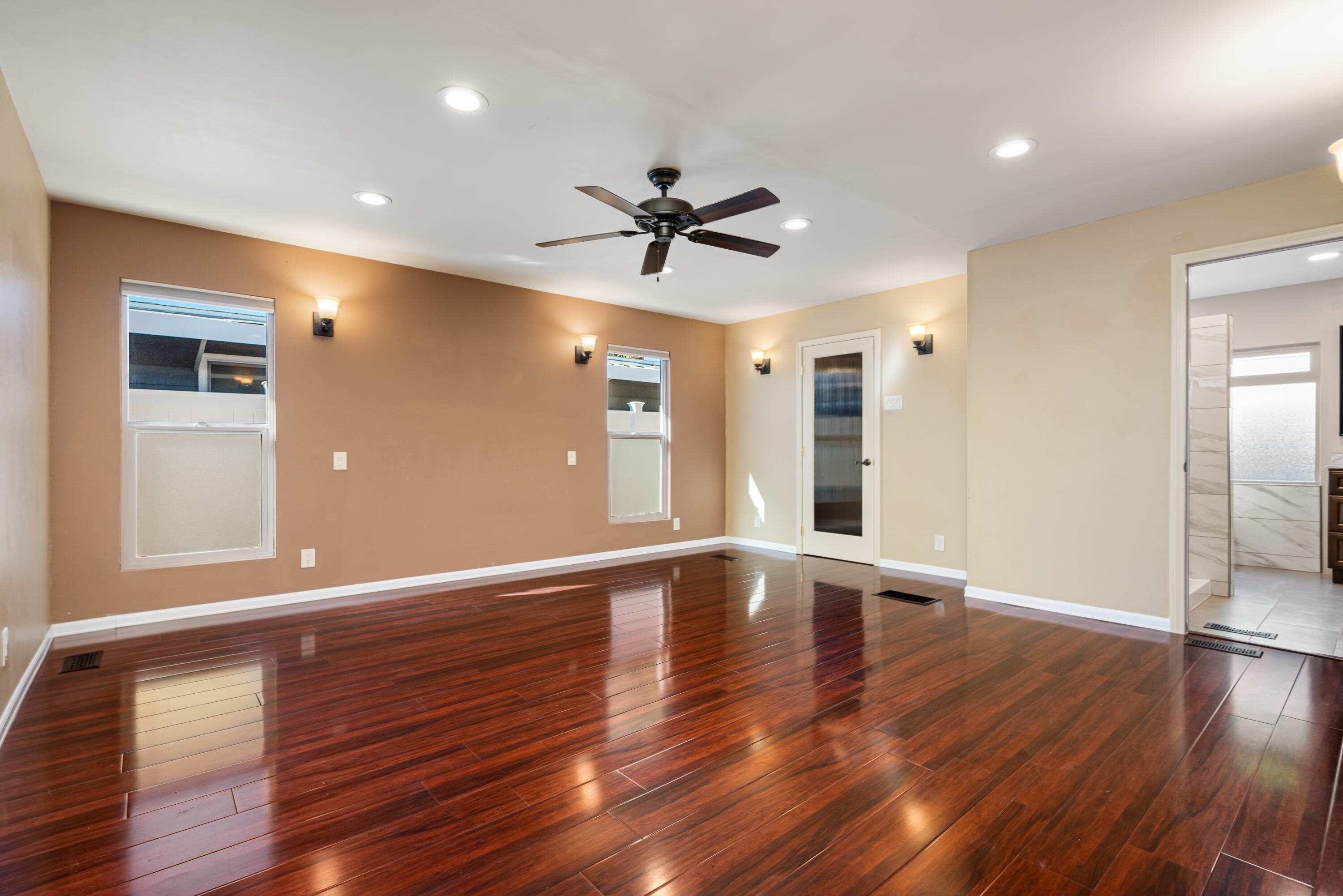 74096 Angels Cp Road Palm Desert, CA 92260 - Photo 29 of 33 a view of an empty room with wooden floor and a ceiling fan