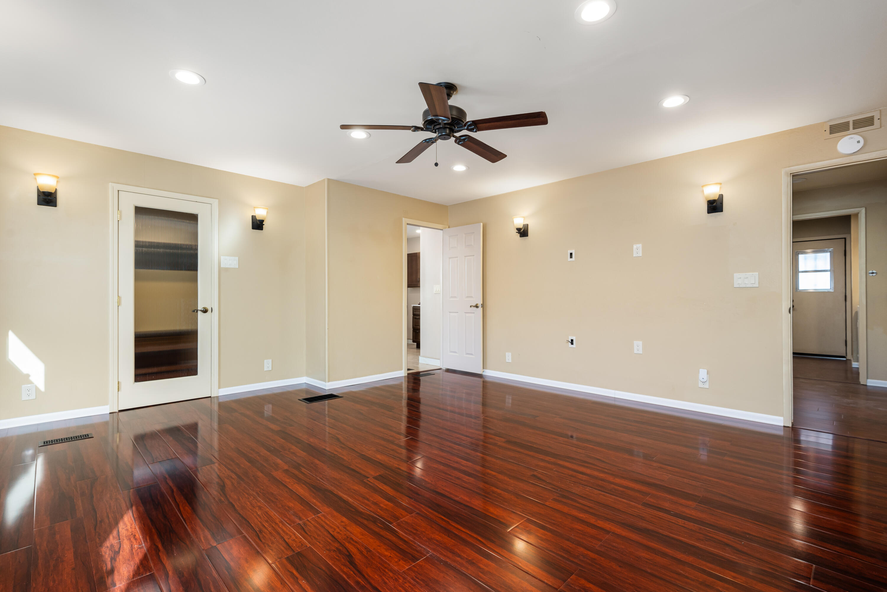 74096 Angels Cp Road Palm Desert, CA 92260 - Photo 30 of 33 a view of an empty room with wooden floor and a ceiling fan
