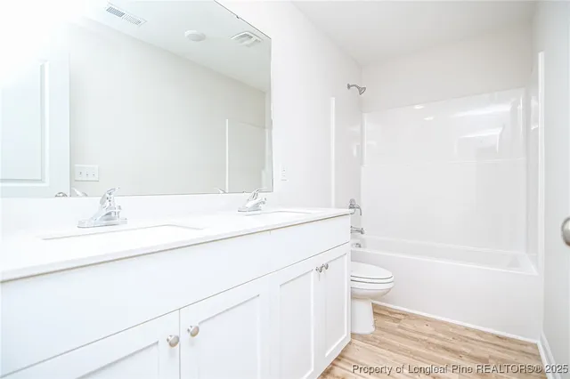 a bathroom with a sink a toilet and a bathtub