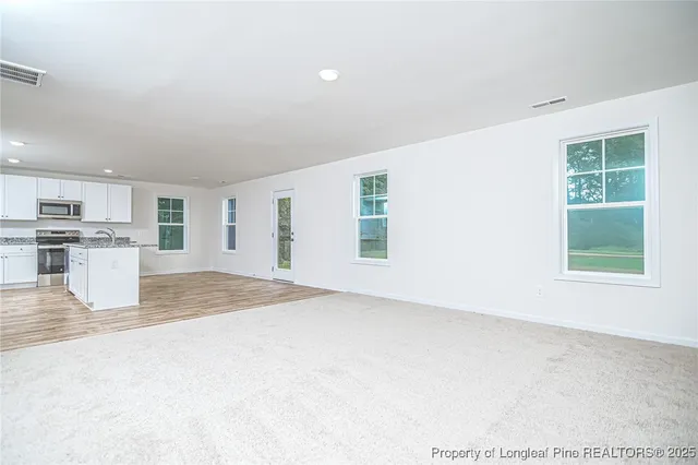 an empty room with windows