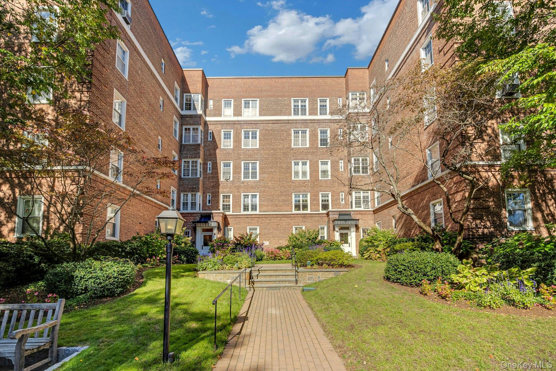 a view of a building with a yard