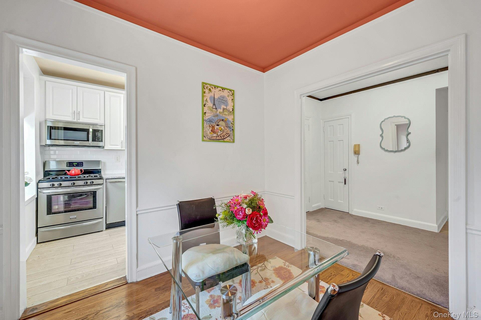 3 Midland Gardens, Unit 3H Bronxville, NY 10708 - Photo 11 of 20 a living room with furniture and a window