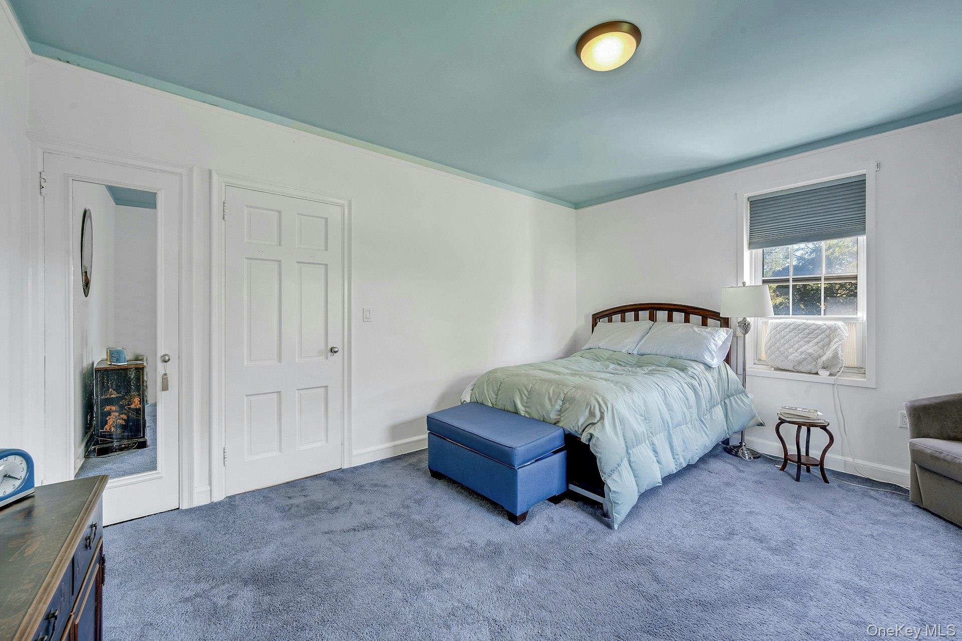 3 Midland Gardens, Unit 3H Bronxville, NY 10708 - Photo 15 of 20 a spacious bedroom with a bed and dresser