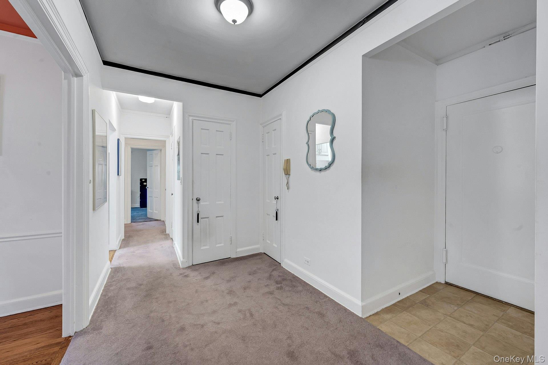 3 Midland Gardens, Unit 3H Bronxville, NY 10708 - Photo 4 of 20 a view of a room with rack on the wall