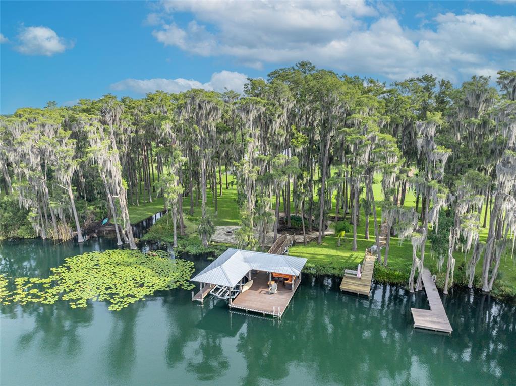 a view of a lake with a yard