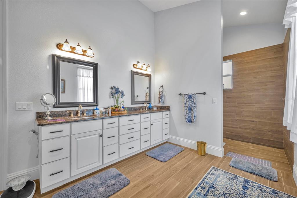 1134 Kelso Boulevard Windermere, FL 34786 - Photo 13 of 37 a spacious bathroom with double vanity and a mirror