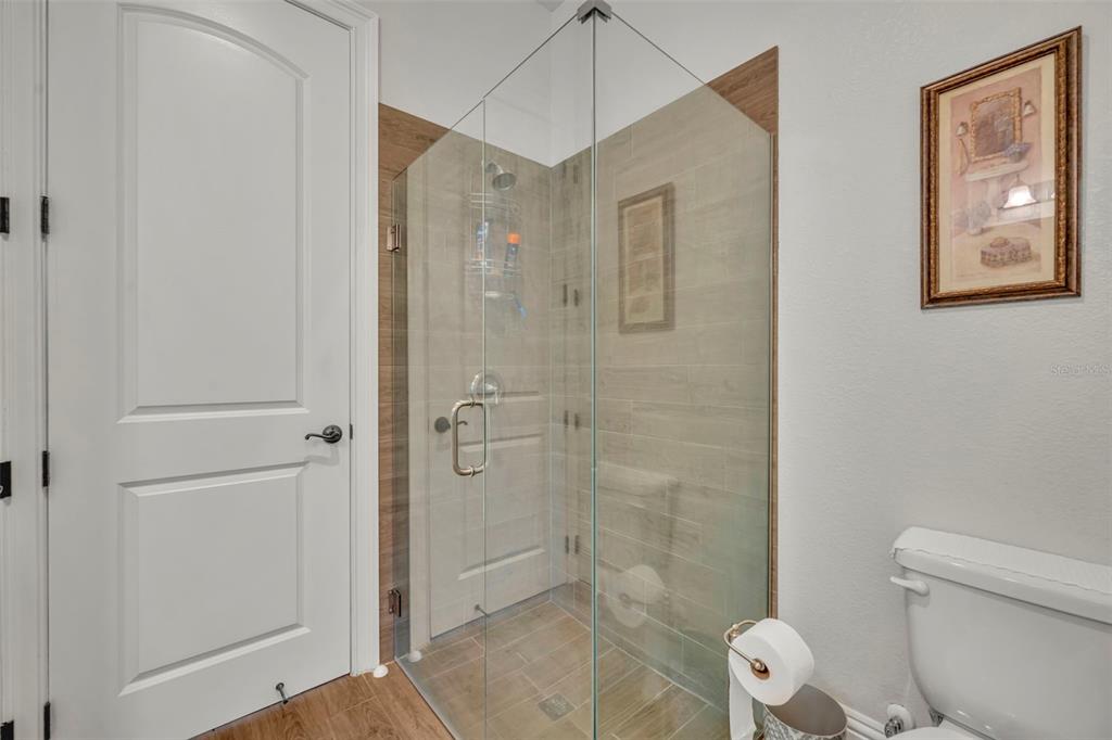 1134 Kelso Boulevard Windermere, FL 34786 - Photo 19 of 37 a bathroom with a shower a toilet and sink