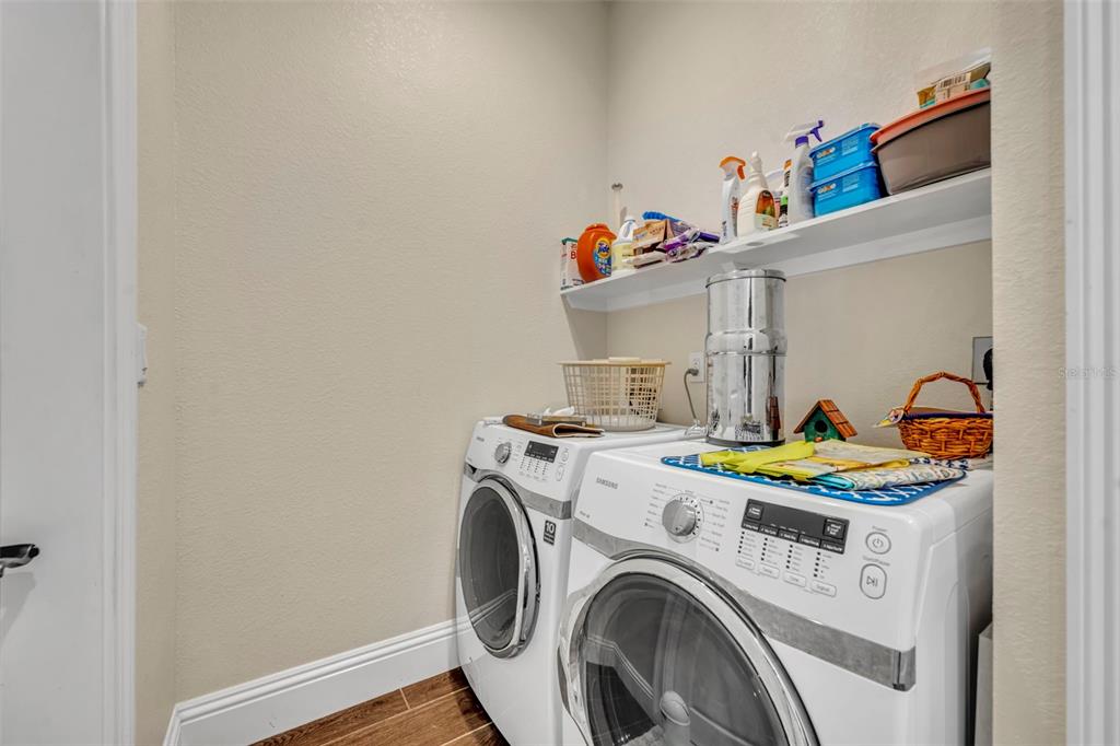 1134 Kelso Boulevard Windermere, FL 34786 - Photo 20 of 37 a utility room with dryer and washer