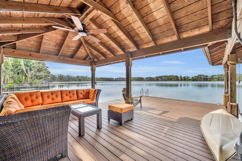 1134 Kelso Boulevard Windermere, FL 34786 - Photo 23 of 37 a wooden bench sitting at roof deck of house