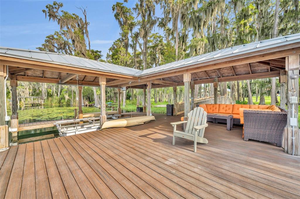 1134 Kelso Boulevard Windermere, FL 34786 - Photo 24 of 37 a view of a patio with a table chairs and a backyard
