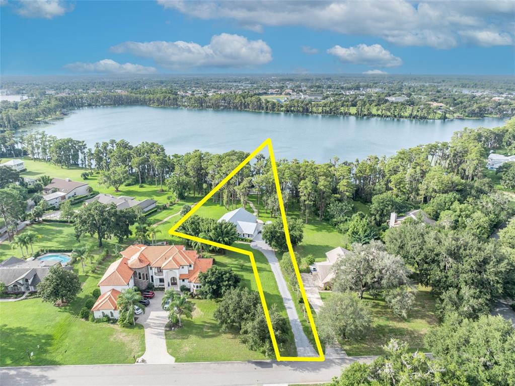 1134 Kelso Boulevard Windermere, FL 34786 - Photo 30 of 37 a view of a lake with a mountain in the background